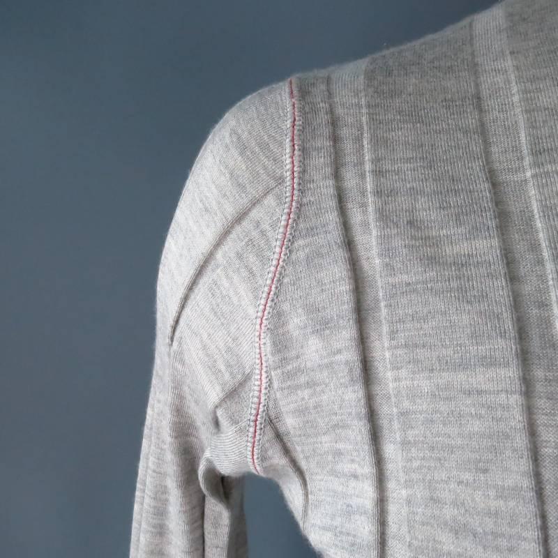 Brunello Cucinelli Pullover consists of cashmere / silk  blend material in a light gray color tone. Designed with crew-neck collar that accents red trim, tone-on-tone stitching along shoulder inseam, ribbed cuffs with blousen hem. In a stripe