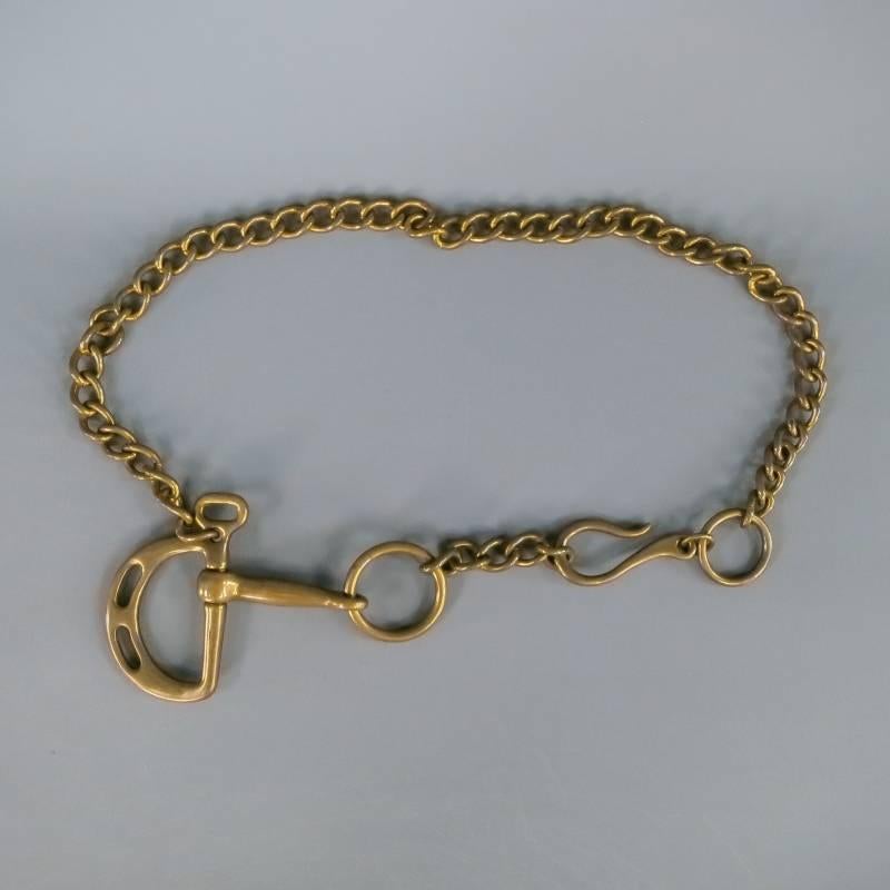 Equestrian chain link belt by RALPH LAUREN COLLECTION. A classic versatile style with bold impact, featuring a horse bit and hook detail. In a deep gold brass. Made in Italy.
 
Excellent Pre-Owned Condition.
 
Measurements:
 
Length: 40 in.