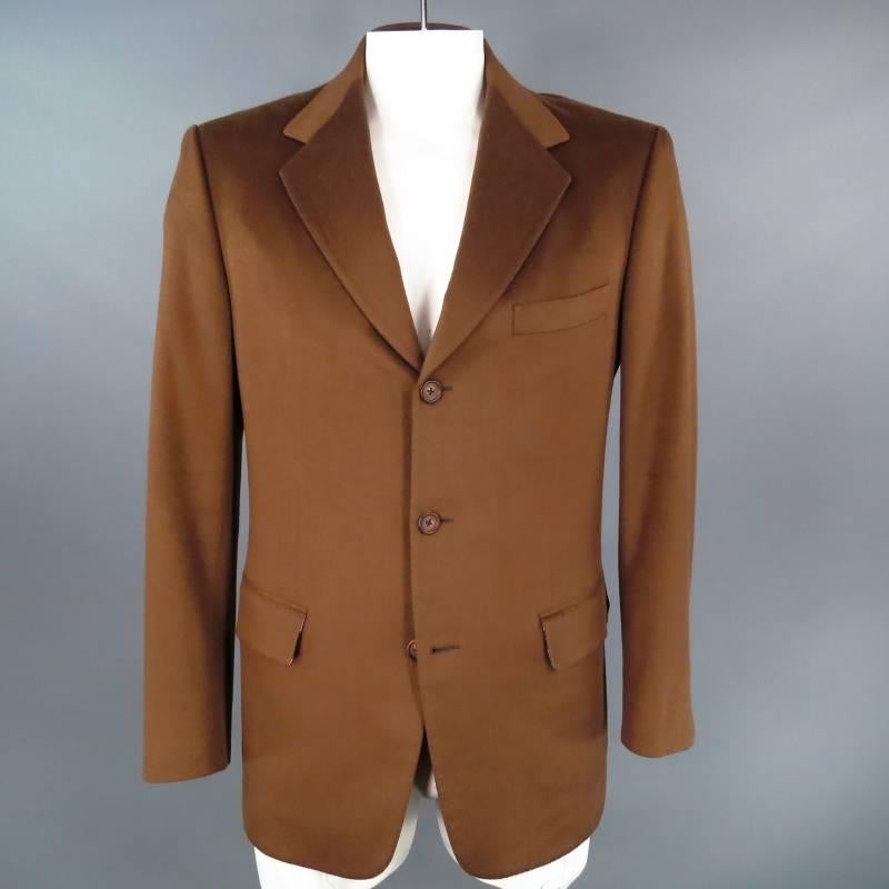 Fabulous custom made sport coat by EDMOND CHOW CALIFORNIA. This one of a kind piece comes in soft brown Loro Piana cashmere and features a notch lapel, three button closure, functional sleeve buttons, double back vent, and beautiful Hermes 