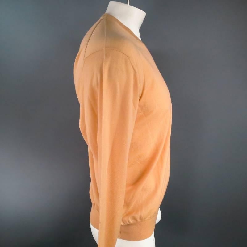 Vintage pullover sweater by GIANNI VERSACE. This classic piece with modern appeal comes in an ultra light weight peach 