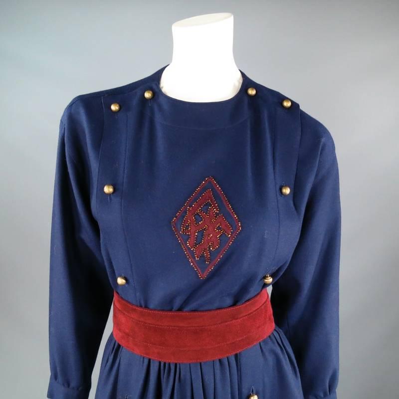 Vintage military inspired winter dress by CHLOE. This rare archive piece comes in a soft navy flannel and features, a high crew neck, long sleeves, buttoned bib closure with gold metal mesh buttons, burgundy embellishment with beading on chest,