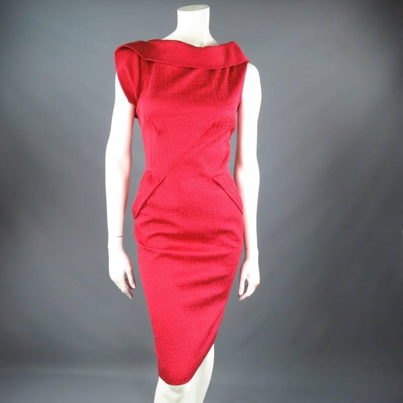 Fabulous structured cocktail dress by OSCAR DE LA RENTA. This unique style comes in a lovely textured cotton blend fabric and features an asymmetrical folded boat neck, side darts, pockets, and optional black ribbon covered waist belt. Made in