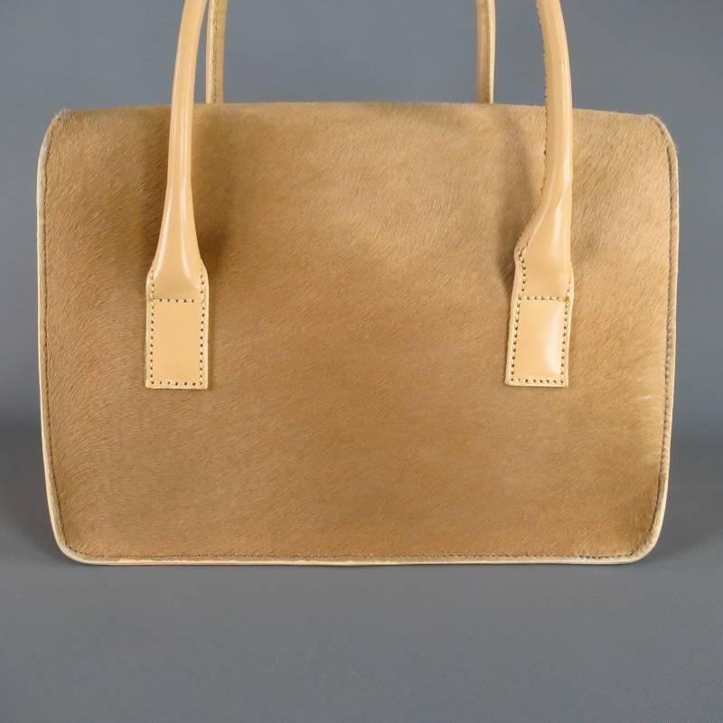 Fabulous structured top handles shoulder bag by LAMBERTSON TRUEX. This rare Italian piece comes in a gorgeous light tan beige pony hair with leather details and features a fold over closure with silver tone logo clasp closure, black suede lining,