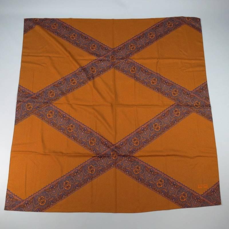 This vintage PATRICK FREY shawl scarf comes in a lovely rust wool featuring a graphic print of navy, orange, and burgundy paisley stripes over a brown checkered back drop. Made in France.
 
Very Good Pre-Owned Condition.
 
53 in. Square