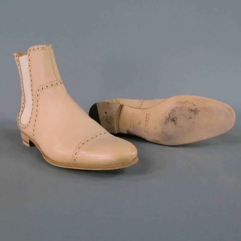 Cream leather Chealsea boots by HERMES. In a gorgeous bone color this slip on style features thick piping with brogue details. A fabulous unique style for everyday. Made in Italy. Retails: $1225.00
 
Excellent Pre-Owned Condition.
 
Tag Size: IT