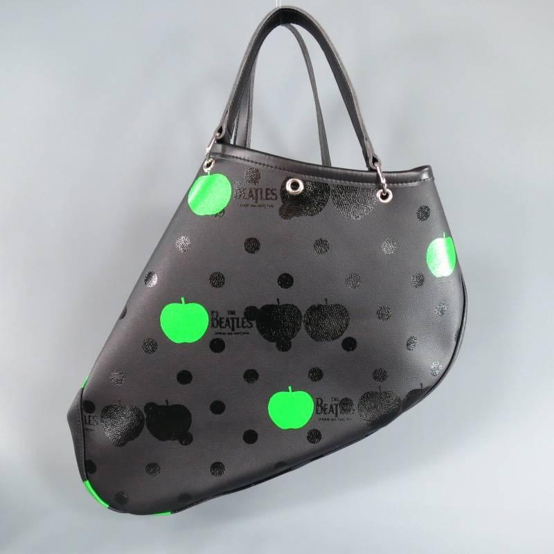 This ultra rare, special addition THE BEATLES x COMME des GARCONS avant garde tote bag comes in a matte coated canvas printed in black glossy polka dots with green apples and 
