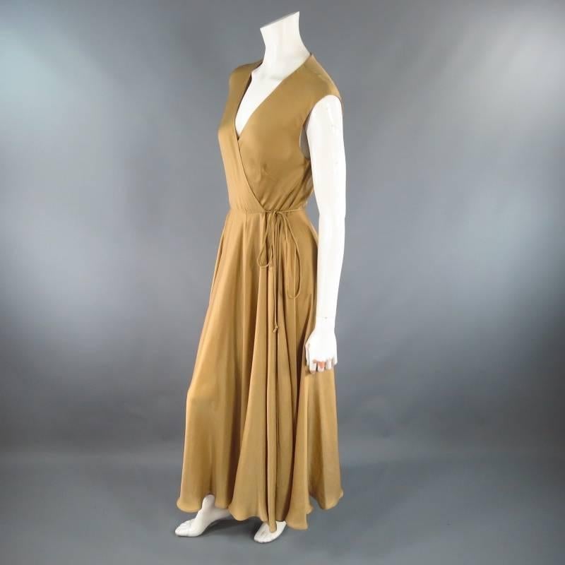 This gorgeous sleeveless wrap dress by RALPH LAUREN comes in a beautiful champagne gold flowing satin and features a deep V neckline, full a line skirt with ruffled hem, and wrap and tie side closure. Perfect for a special event or a lovely resort