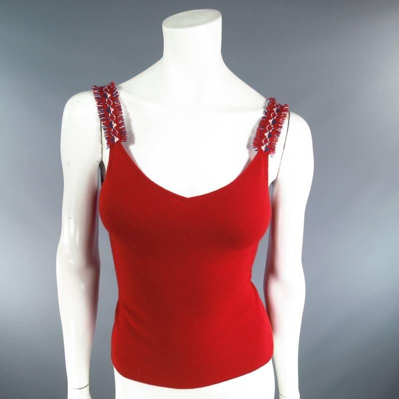 This set includes:

This fabulous Fall 2003 CHANEL knit tank top comes in a soft red cashmere and features a V neckline and red, white, and teal patterned straps with frayed edges. Made in The UK.
 
Excellent Pre-owned Condition.
 
Shoulder: