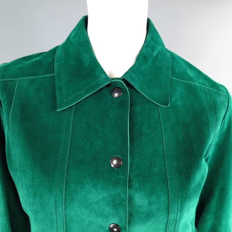This ultra chic COSTUME NATIONAL trucker denim style jacket comes in a beautiful, vibrant emerald green suede and features a pointed collar, frontal slit pockets, snap closure, snap closure sleeves, and back tabs. A modern twist on a classic staple.