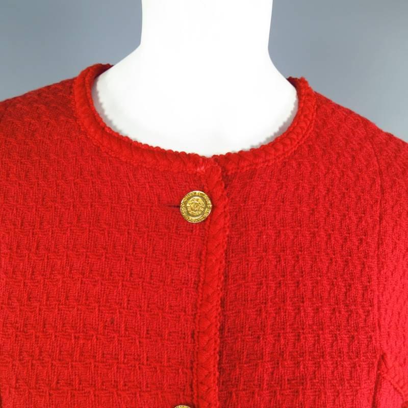 This vintage CHANEL jacket comes in a vibrant red tweed and is impeccably tailored to an hourglass shape featuring gold tone 