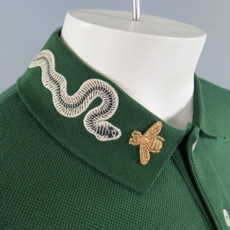 Brand New Gucci Short Sleeve Polo consists of cotton blend material in a green color tone. Designed with Alessandro Michele's signature details, embroidered (green snake) applique is applied along the collar with a gold embroidered bee detail, a new