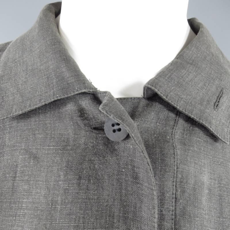 ISSEY MIYAKE washed linen blouse is vintage and features jetted breast pockets, single button closure, slouch shoulders and asymmetric hem in graphite gray, made in Japan.

Excellent Pre-Owned Condition    Marked: