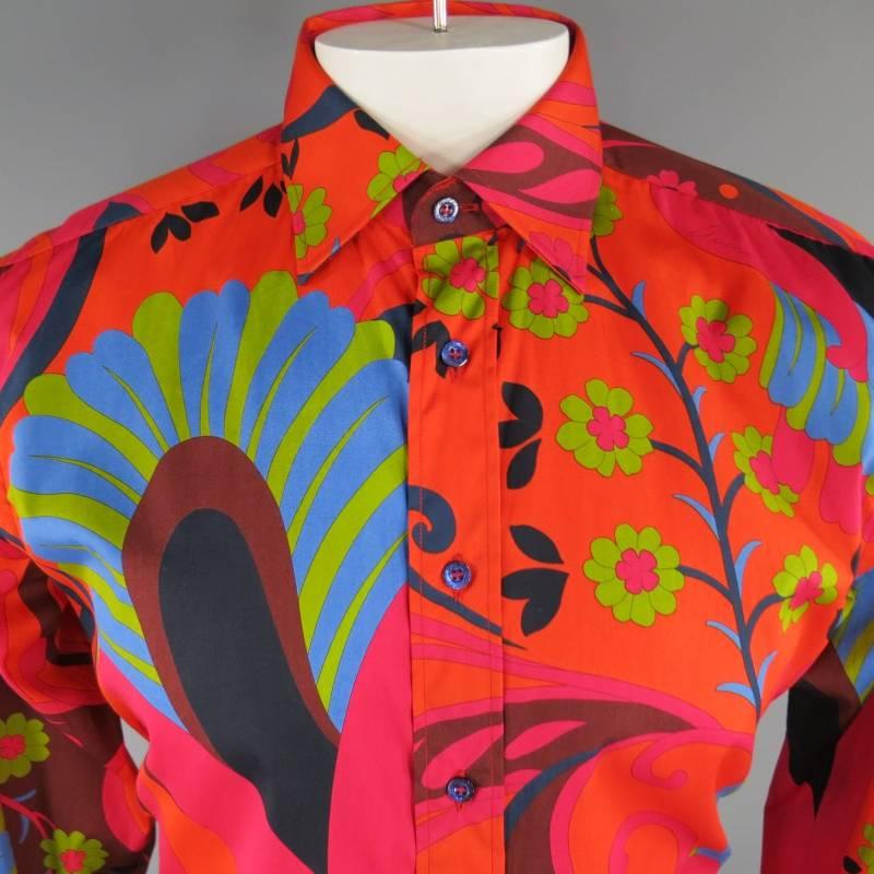 This rare TOM FORD for GUCCI shirt comes in a vibrant orange retro Pucci inspired floral print with accents of fucsia, blue and green. Made in Italy.
 
Excellent Pre-Owned Condition.
Marked: IV / L
 
Measurements:
 
Shoulder: 18 in.
Chest: