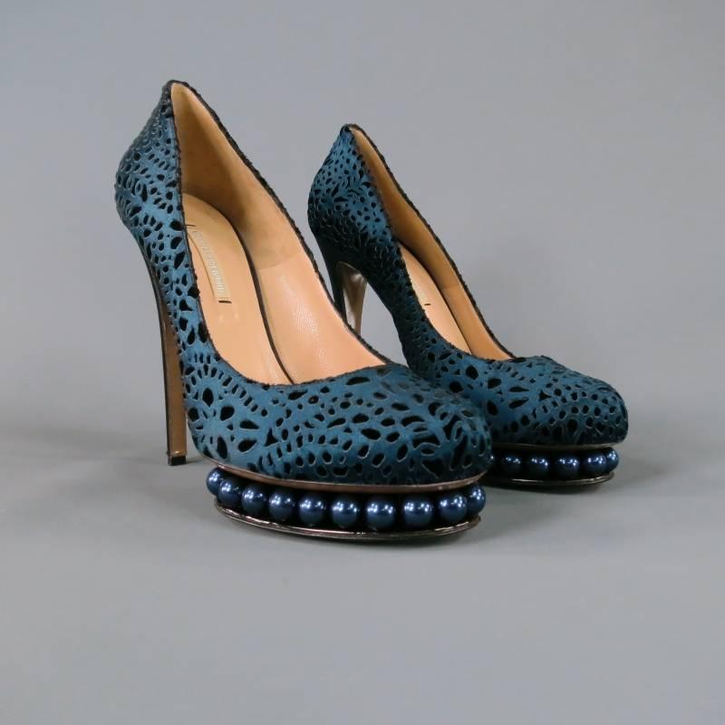 Gorgeous navy platform pumps by NICHOLAS KIRKWOOD. Featuring lazer cut velvet patterned silk base, pearl embellished platform, and sleek navy silk heel, these shoes are truly a work of art. Made in Italy. Retails at $1116.00.
 
Excellent Pre-Owned