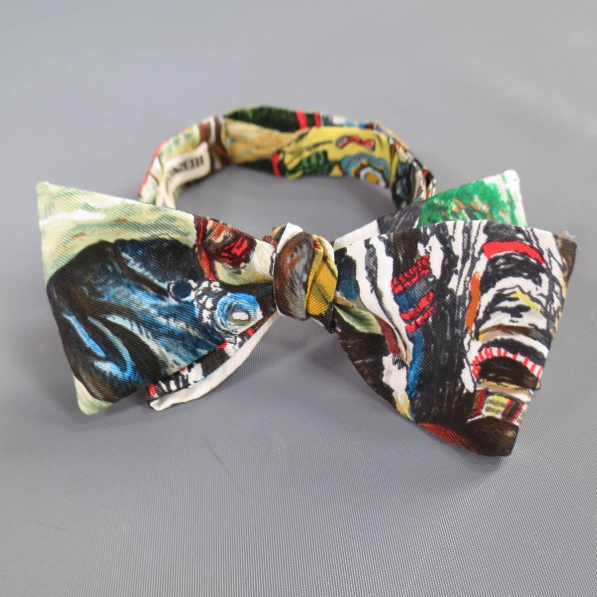 This rare vintage HERMES bow tie and pleated cummberbund set comes in a multi-color beige graphic wilderness print silk with gold tone hardware. Made in France.
 
Good Pre-Owned Condition.
 
Cummerbund: 37 x 5.25 in.