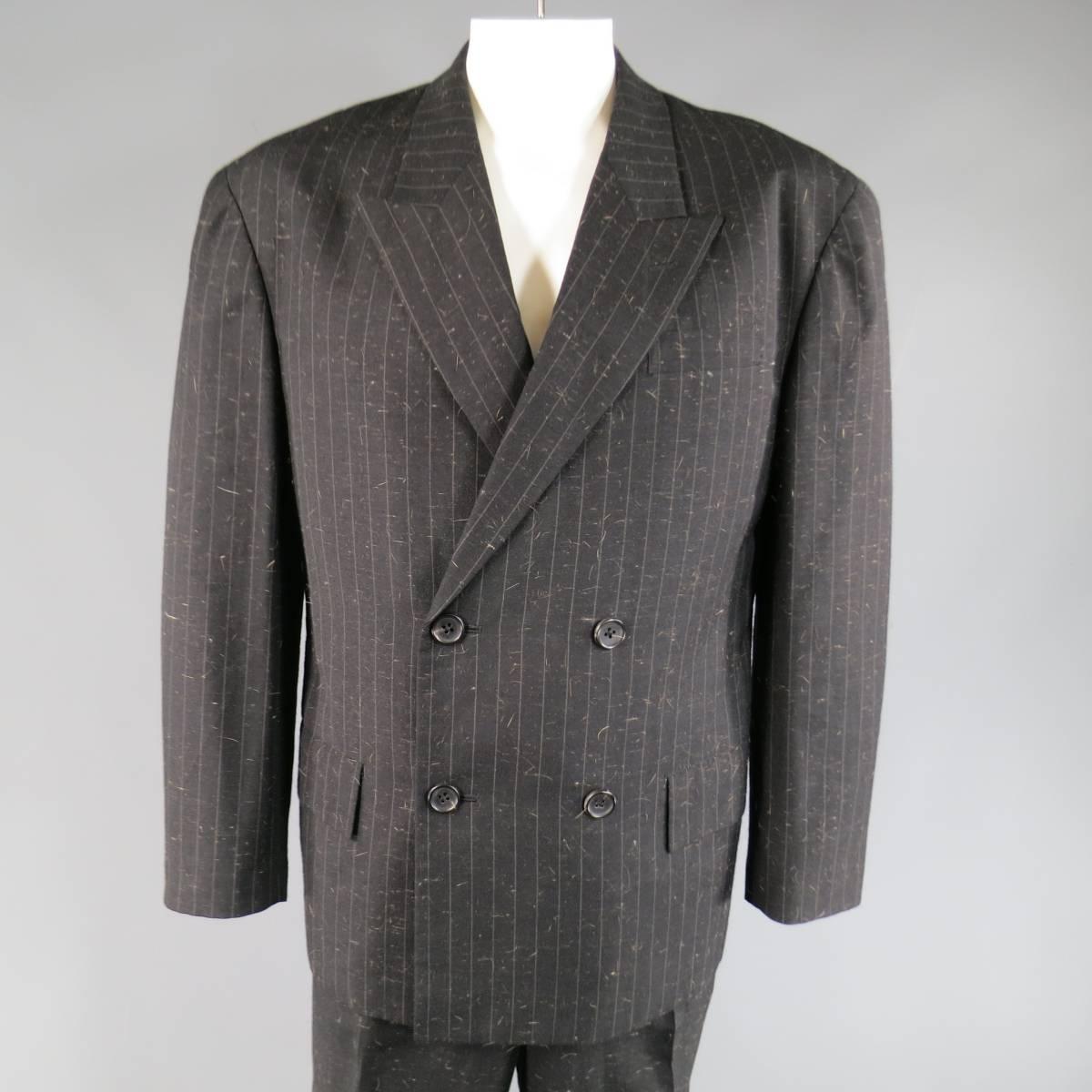 Rare vintage Yohji Yamamoto Pour Homme suit includes an oversized, double breasted peak lapel sport coat in a unique charcoal pinstripe brown hair textured wool blend and solid textured cuffed hem, flat front trousers. Made in Japan.
 
Excellent