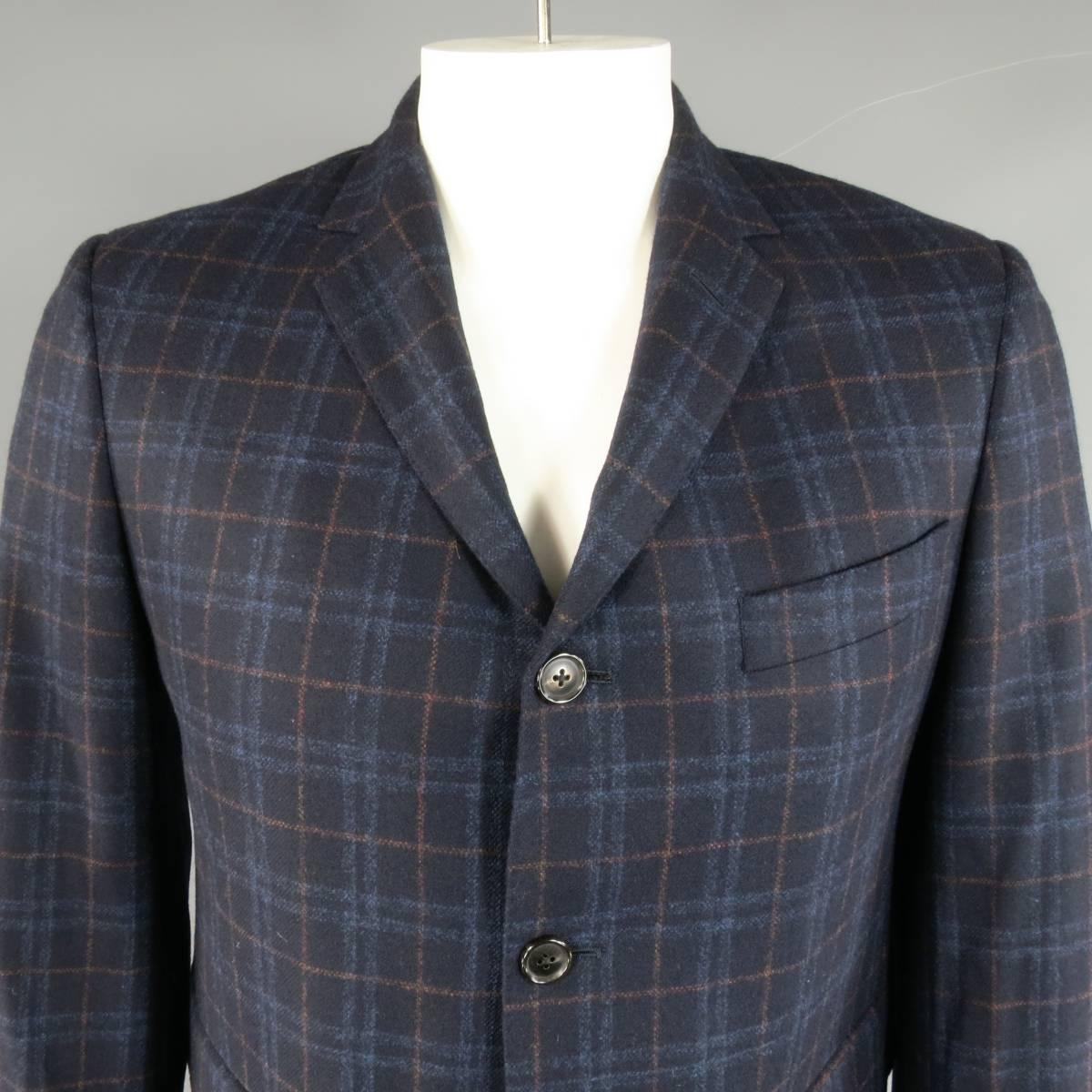 BRAND NEW BLACK FLEECE Sport Coat consists of wool/ cashmere material in a navy color tone. Designed in a 2-button front, notch lapel collar, top pocket square and bottom flap. Detailed plaid pattern throughout body with red accent and double back