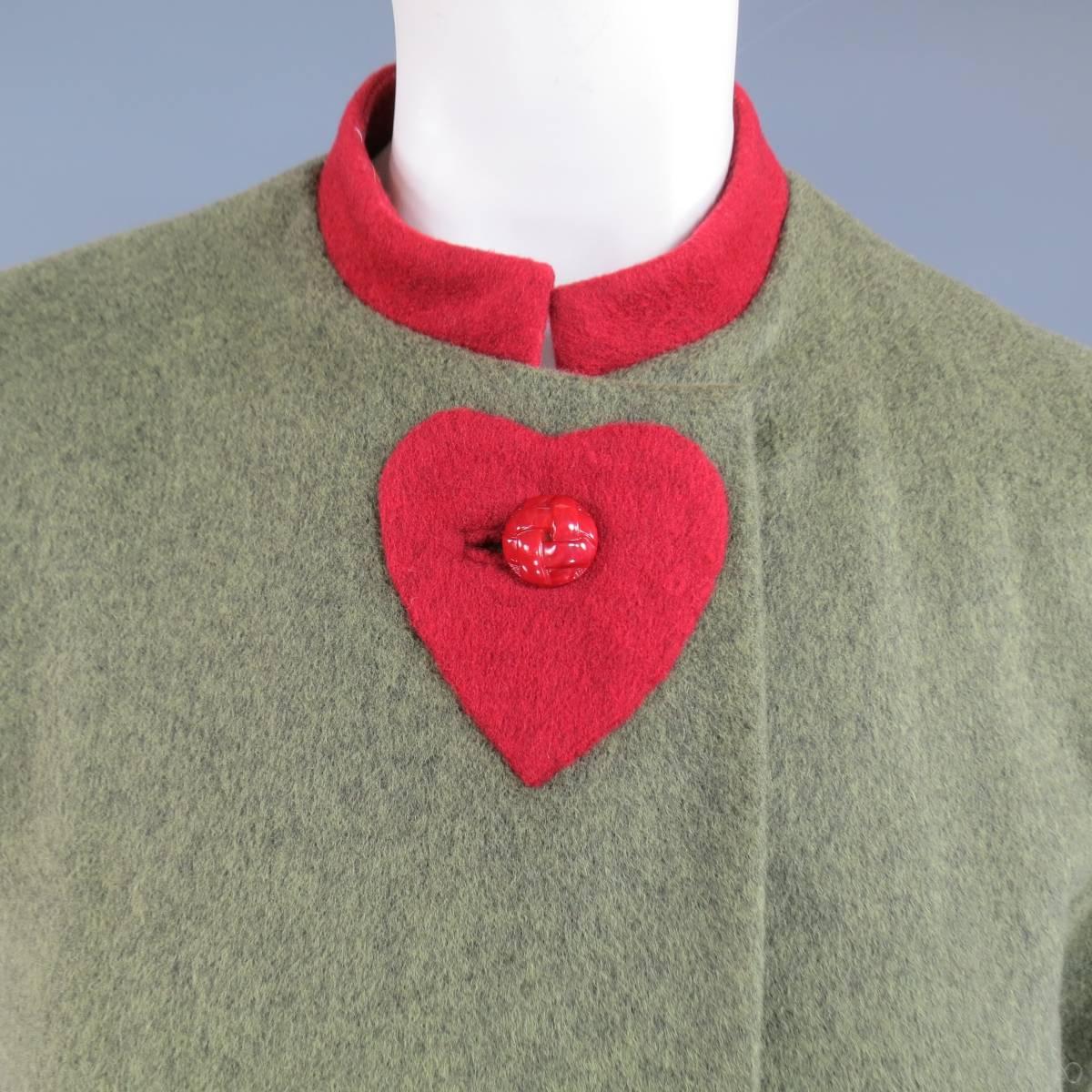Vintage CAROLINA HERRERA skirt suit includes a jacket in a light olive green Heather textured wool cashmere blend felt featuring a red stand up band collar, red braid textured buttons, and red heart patches along the closure with a matching red