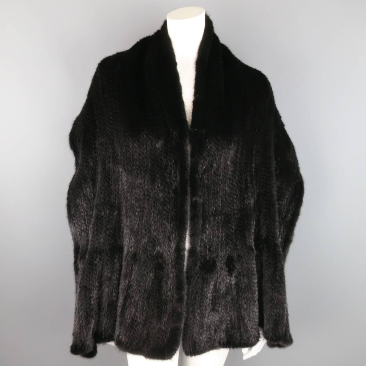 Classic scarf stole by SAKS FITH AVE Fur Salon in a knitted black mink featuring a hook eye closures at front.
 
Excellent Pre-Owned Condition.
 
70 x 24 in.
