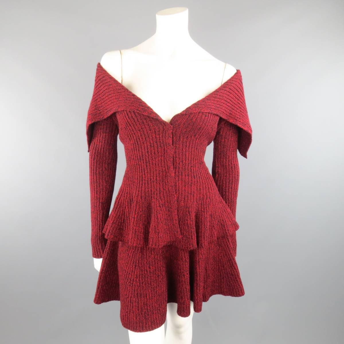 ALEXANDER MCQUEEN knitwear set includes comes in a burgundy, red, and black Heathered wool knit and includes a large, fold over shawl collar, hidden snap closure, and peplum waist cardigan jacket and matching ruffled mini skirt. Made in Italy.
