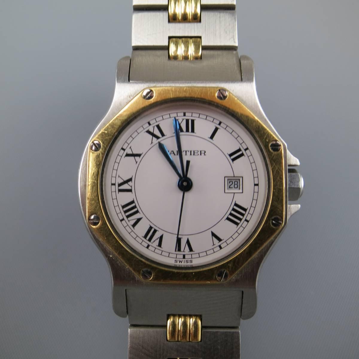 Vintage CARTIER Tank watch comes in silver ton stainless steel with 18k gold details and features an octagonal face with screw details and clasp closure. Minor wear. Swiss Made.
 
Retails at $5,800.00

Good Pre-Owned Condition.
Marked: 296642497
