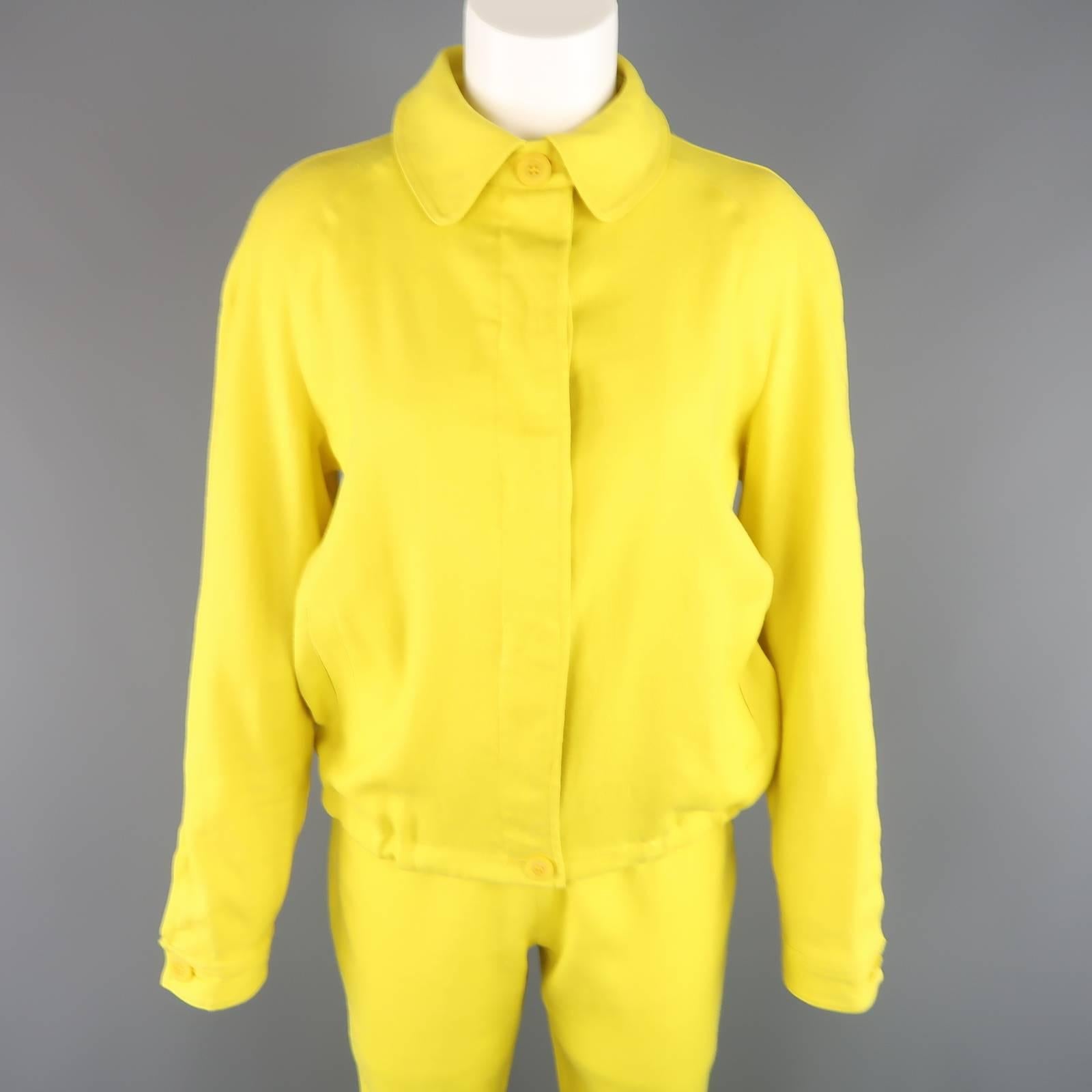 Vintage GIANFRANCO FERRE JEANS outfit comes in a bold yellow linen blend fabric and includes a collared, hidden placket button closure, drawstring jacket and matching capri pants. Made in Italy.
 
Good Pre-Owned Condition.
Marked: 44
