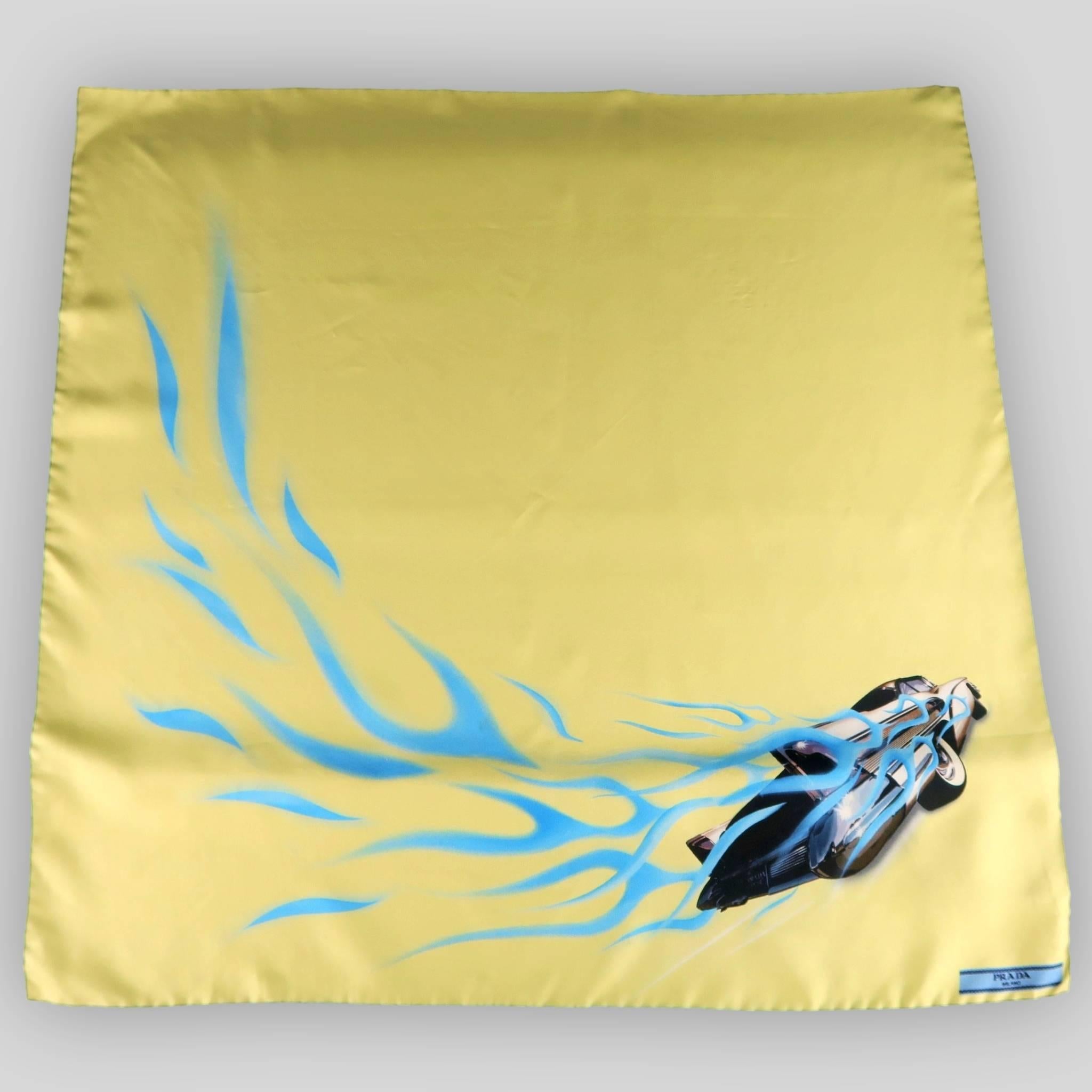 PRADA scarf comes in light yellow silk twill and features Spring 2015 blue car and flame graphic print and black piping. Minor wear. with box. Made in Italy.
 
Good Pre-Owned Condition.
 
23 x 23 in.


SKU: 85370