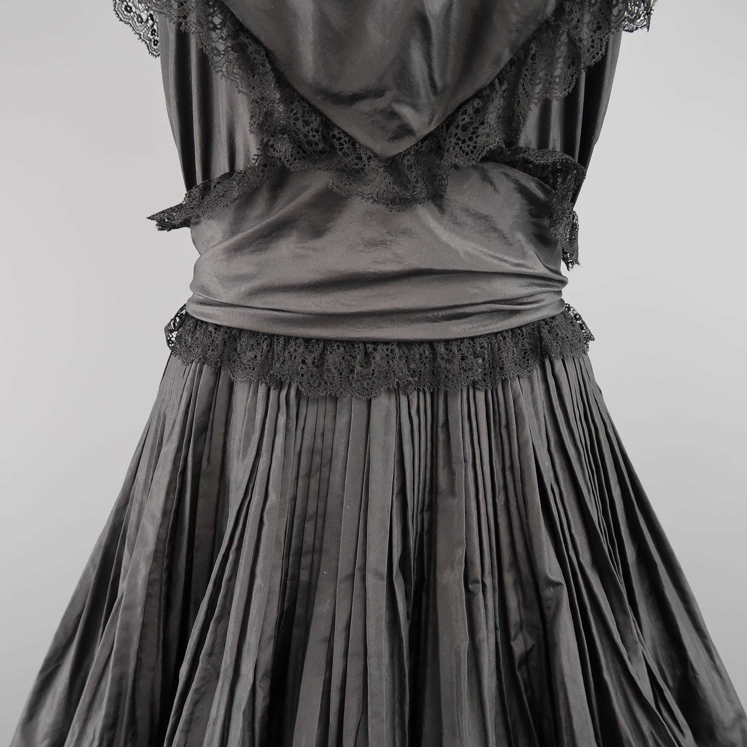 This gorgeous CHANEL cocktail dress comes in black silk taffeta with lace piping throughout and features a scarf panel front that ties in back, gathered sash waistband, and pleated poof bubble skirt with drop waist, bow detailed, pencil bottom.