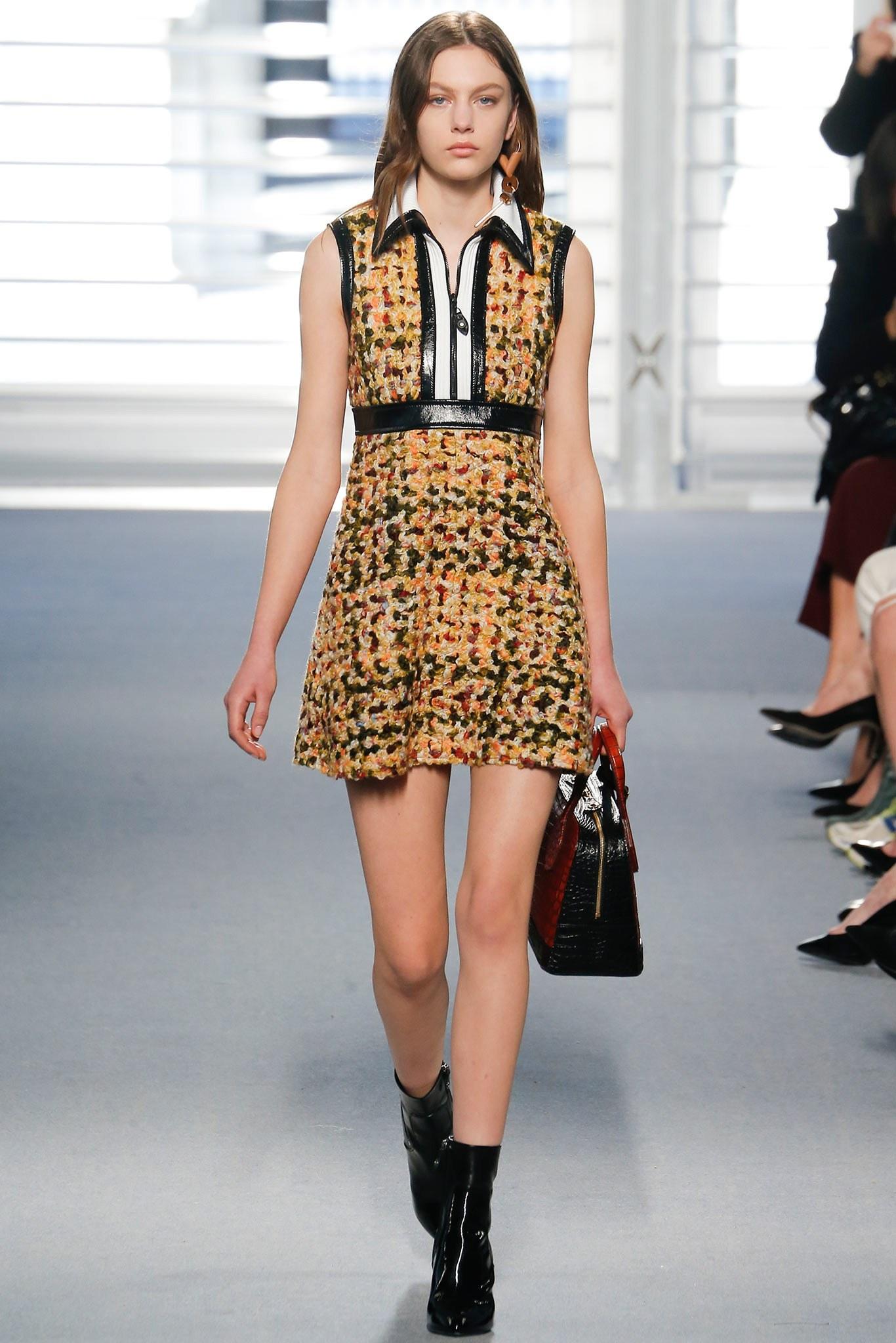 Louis Vuitton by Nicolas Ghesquiere Fall 2014 Collection sleeveless dress comes in yellow and green boucle with a white, black patent leather trimmed ribbed knit collar and half zip top, green textured trim, and quilted A line skirt. Made in