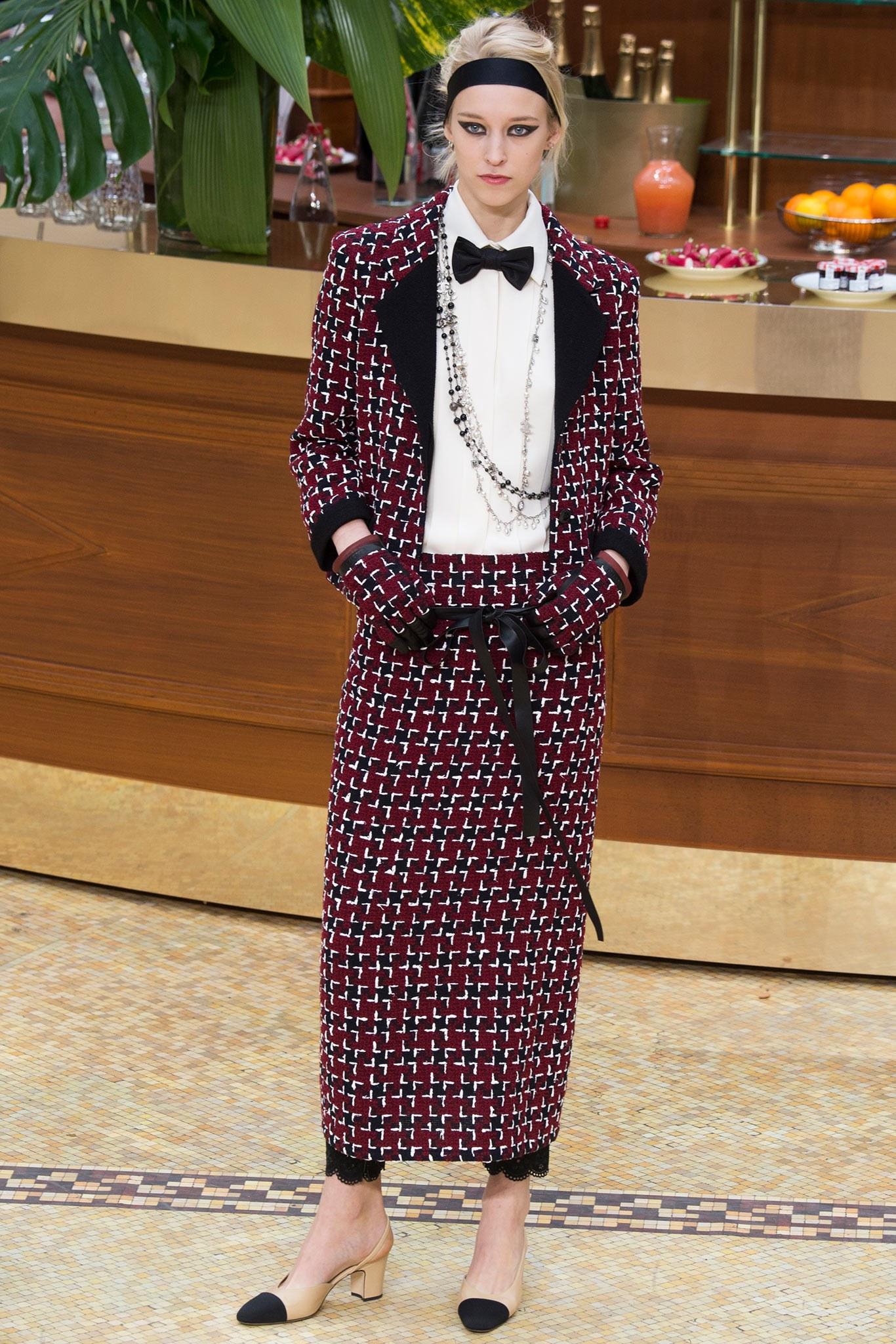 CHANEL Fall 2015 Collection jacket comes in burgundy, navy, and cream houndstooth tweed with a half black notch lapel, three button closure with clear CC buttons, and black trimmed pockets and cuffs. Made in France.  Retailed $5850
 
Excellent