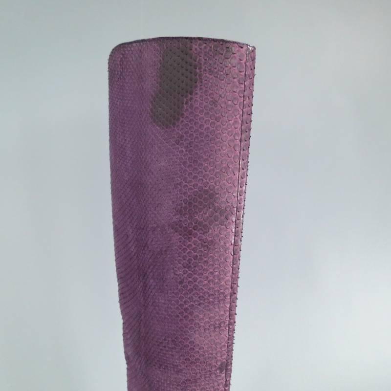 Fabulous knee high python boots by CHRISTIAN DIOR. This unique luxury style comes in beautiful textured purple python leather and features chocolate brown pebbled leather ankle strap with silver tone buckle, leather covered heel, leather platform.