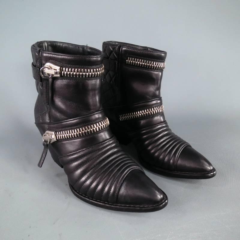 Fabulous moto style ankle boots by GIUSEPPE ZANOTTI. A chic and edgy style in smooth black leather featuring a pointed toe with ribbed panel, over sized zipper details, quilted back panel with overlay, and underslung Cuban heel. Made in Italy.
