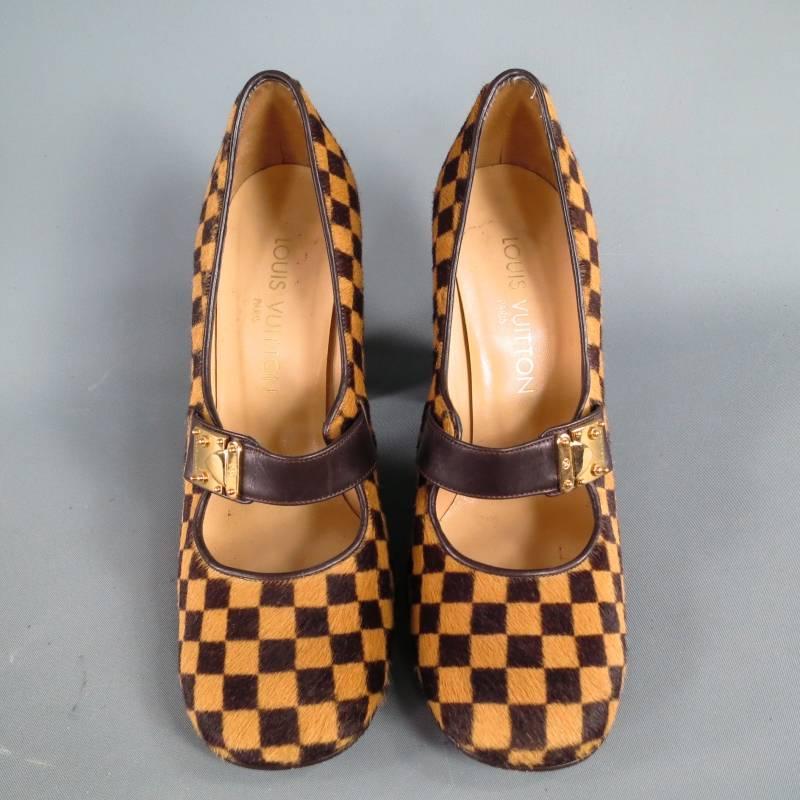 Fabulous statement pumps by LOUIS VUITTON. A retro inspired style in gorgeous tan and chocolate brown Damier checkered pony hair featuring a rounded square toe, thick chocolate brown leather Mary Jane strap with gold tone decorative LV engraved
