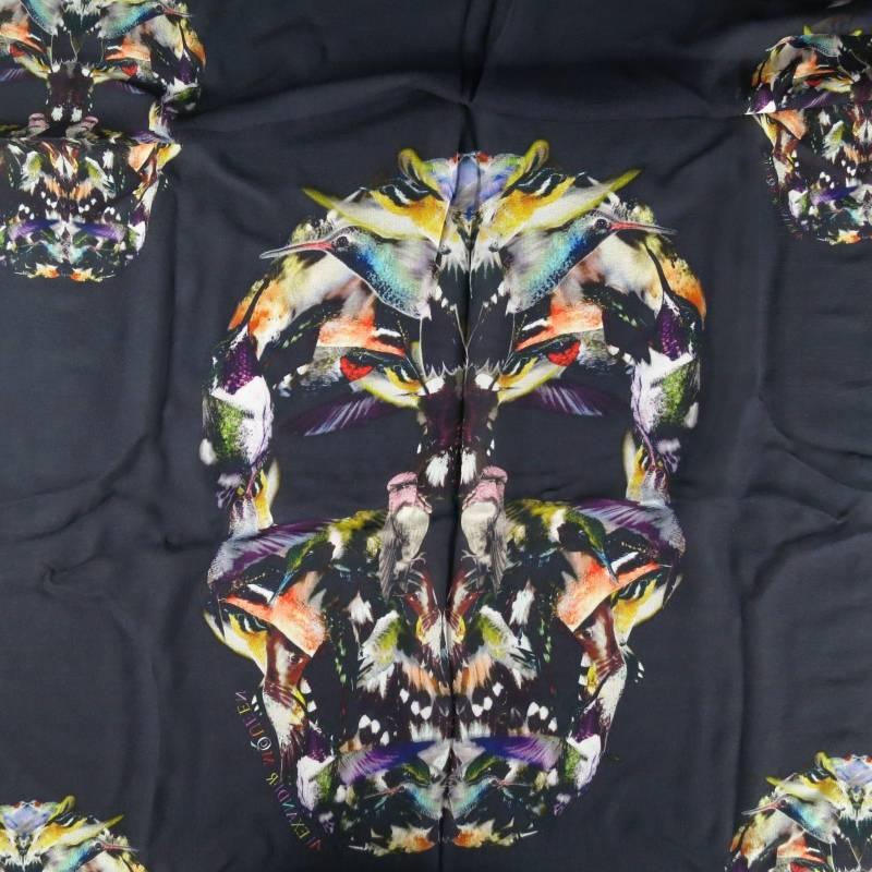 Beautiful black silk chiffon scarf by ALEXANDER MCQUEEN. A rare and unique style featuring gorgeous colorful skull kaleidoscope graphics made of bird photographs and a smoke border with various birds in flight. Made in Italy.
 
Excellent Pre-Owned