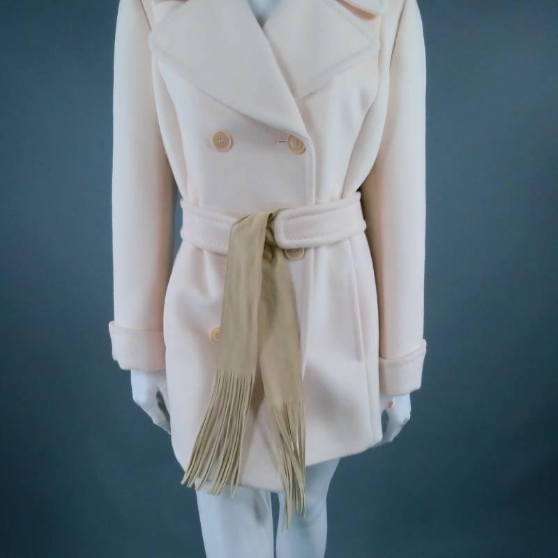 Fabulous cream peacoat by MAX MARA. In a soft wool blend, this piece comes in a classic double-breasted style and features an iconic western twist with a beige suede fringe tie added to the belt. Made in Italy.
 
Excellent Pre-Owned Condition.
