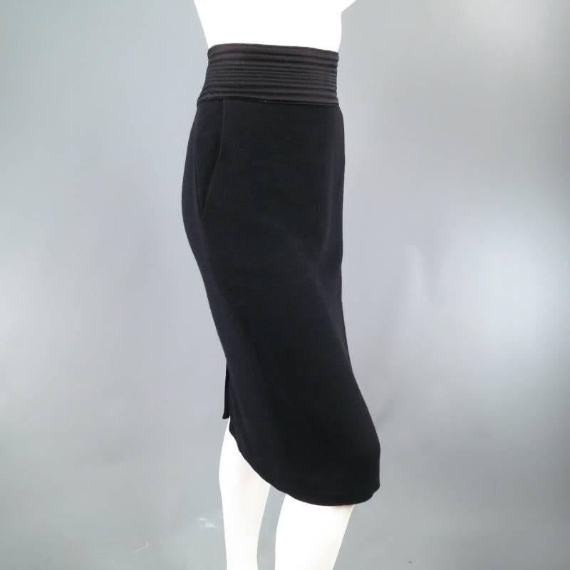 Lovely bodycon pencil skirt by JEAN PAUL GAULTER. This classic and sexy piece comes in a micro ribbed stretch wool and features side pockets, invisible zip closure, and thick satin ribbed cummerbund waist band. Made in Italy.
 
Excellent Pre-Owned