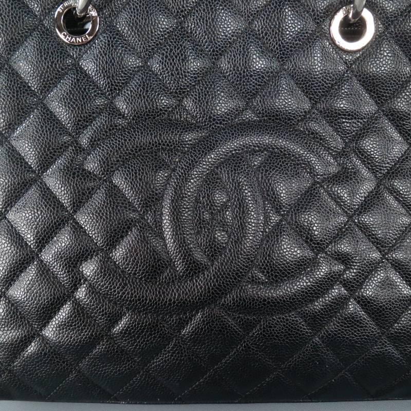 Fabulous 'Grand Shopper' tote by CHANEL. This style comes in black quilted, pebble textured leather and features a large 