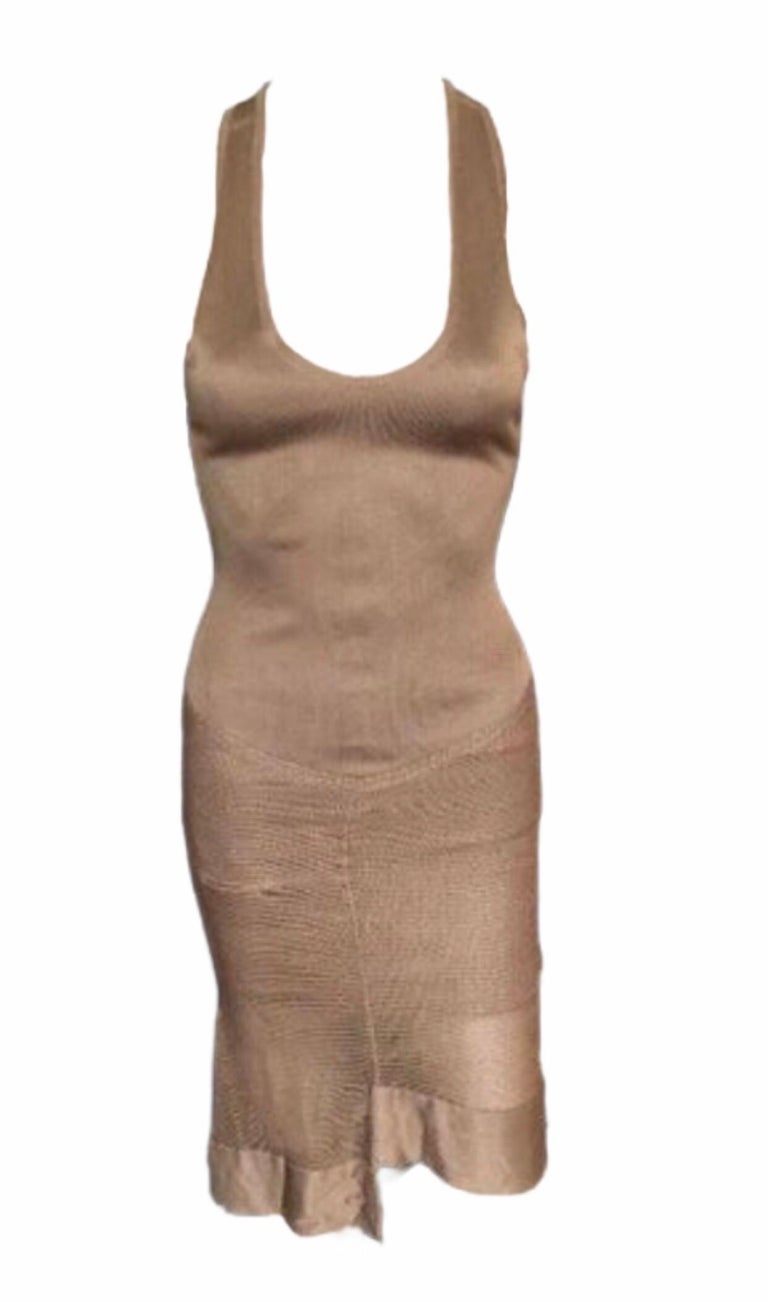 Alaïa sleeveless midi dress with scoop neck, rib knit trim and snap closures at back.

All Eyes on Alaïa

For the last half-century, the world’s most fashionable and adventuresome women have turned to Azzedine Alaïa for body-enhancing clothes that