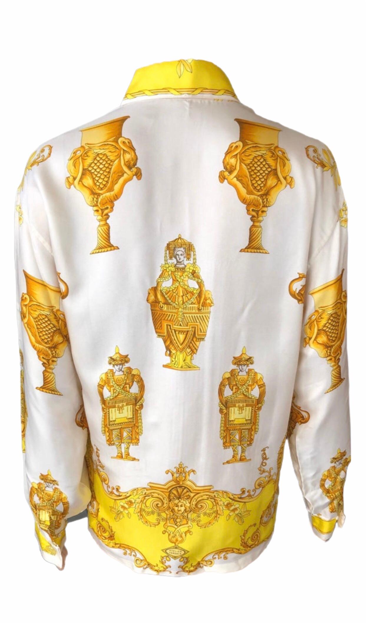 GIANNI VERSACE Vintage Sexy Plunging Decollete Silk Shirt Top IT 44

Versace vintage long sleeve blouse featuring print throughout, pointed collar and concealed button closures at front.

About Versace: Founded in 1978 by the late Gianni Versace,