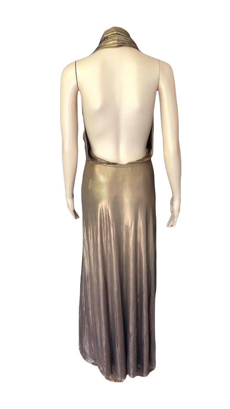 Gucci Runway F/W 2006 Plunging Neckline Backless Gold Metallic Dress Gown For Sale at 1stDibs | gold gucci dress, gucci gold dress, gucci dressing gown Gucci Runway F/W 2006 Plunging Neckline Backless Gold Metallic Dress Gown For Sale at 1stDibs | gold gucci dress, gucci gold dress, gucci dressing gown