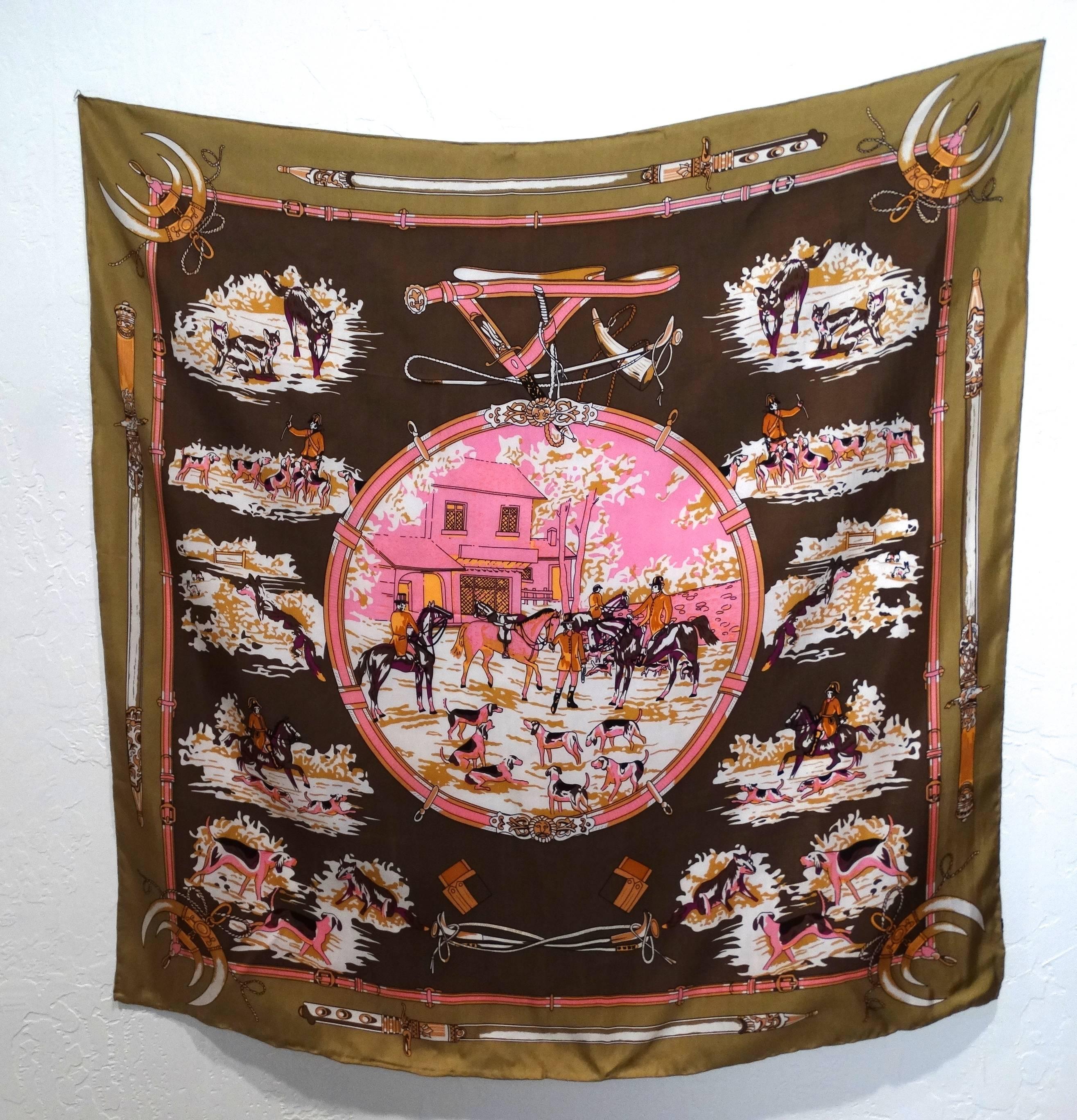 Beautiful late 1970's Hermes silk twill scarf in a beautiful color way of hot pink, orange, white and a two-tone brown.  a period motif of old english riders on horses and hunting dogs. Label in classic Hermes orange 100% Silk

Scarf measures