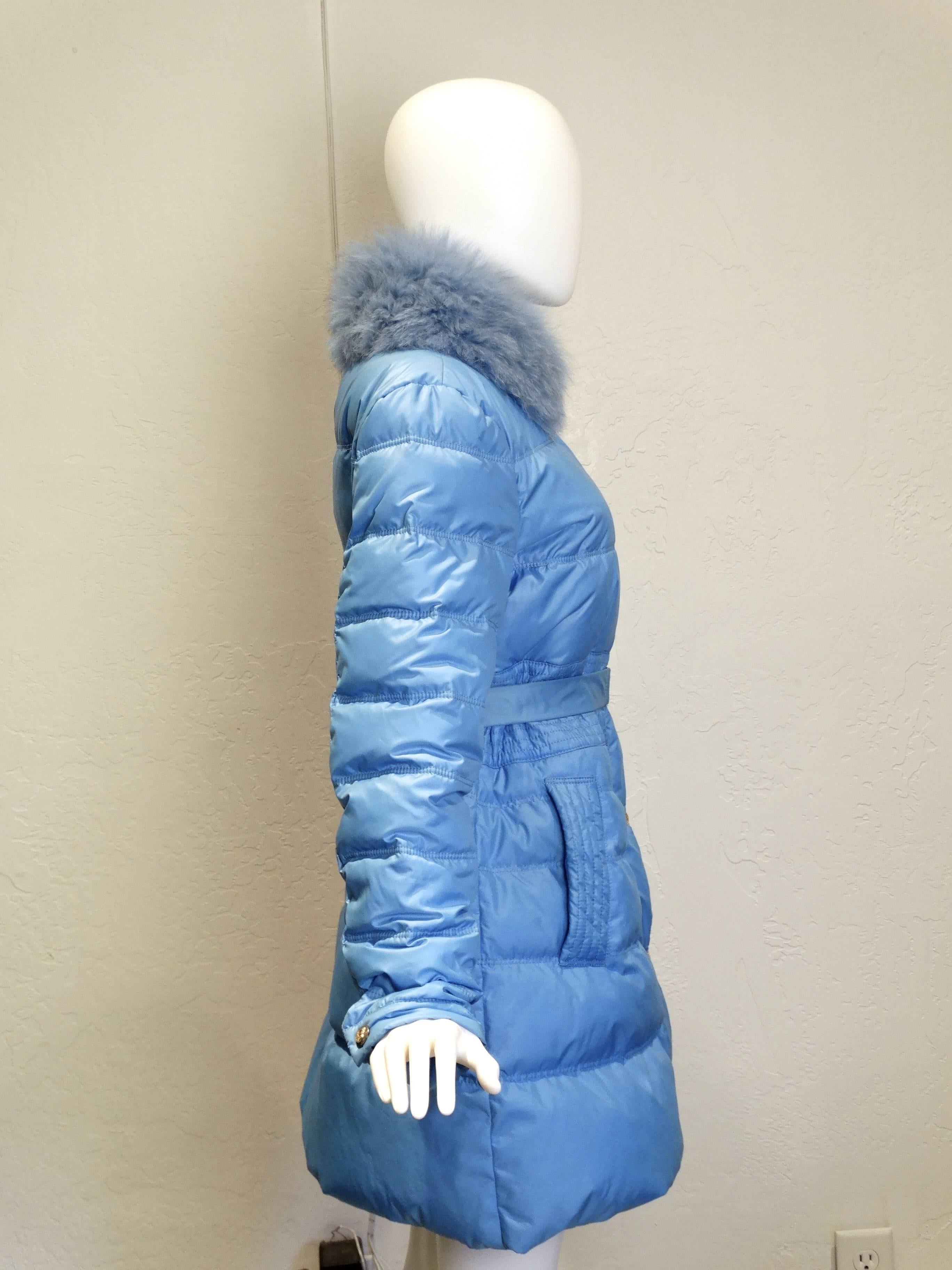 Capri Blue feather down belted padded jacket from Versace Collection Winter Coat circa 2013 featuring a funnel neck with a blue mink fur trim (which is detachable) a front zipper fastening with a hidden zipper. Large half medusa head button snaps go