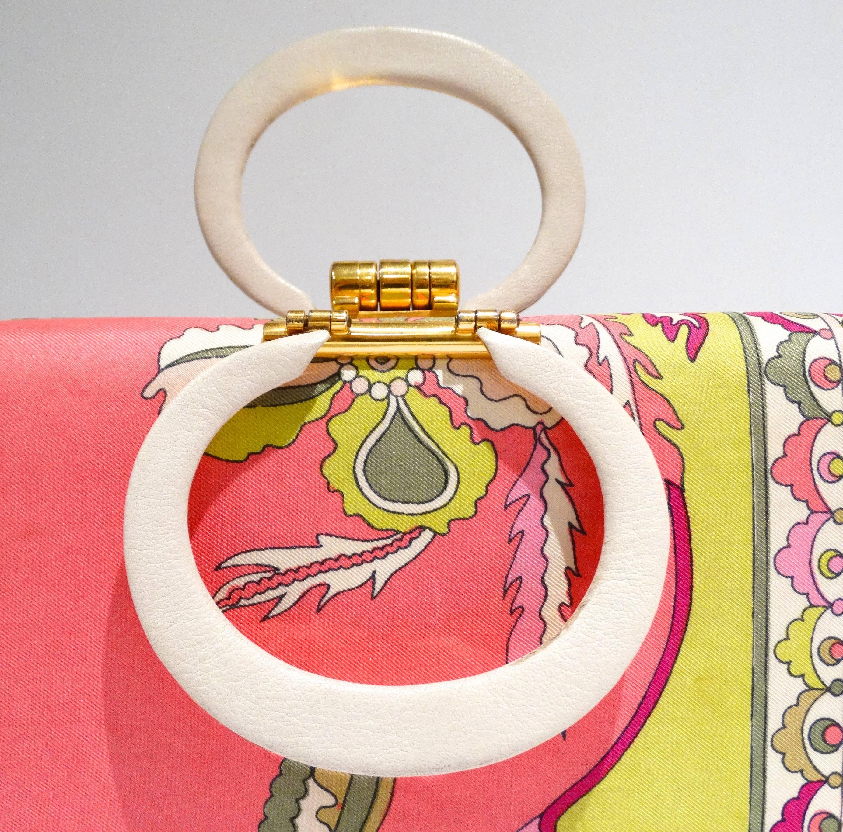 Who doesn't love vintage Pucci??? Especially handbags! This adorable little 60's vintage Pucci box purse is covered with silk fabric with gorgeous pinks, yellows, & white. Inside is buttery soft leather with gold lettering 
