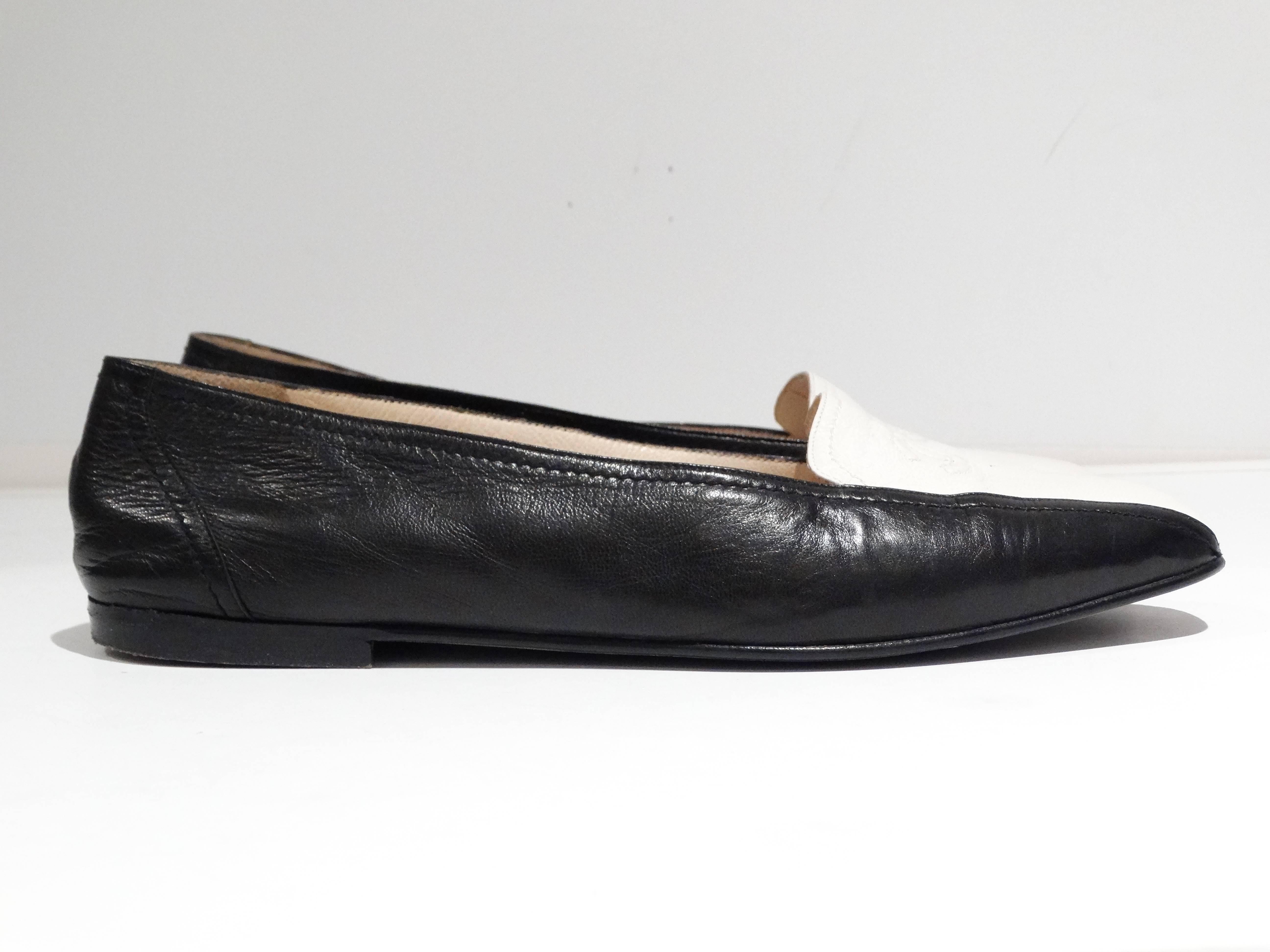 Rare and Beautiful these Chanel Loafers are black and white 2-tone. Soft calf skin leather, with large CC symbol on the top of the shoe. The white in the middle gives these flats a very avant-garde look!  

 Sz 37 1/2 if you would like to see on