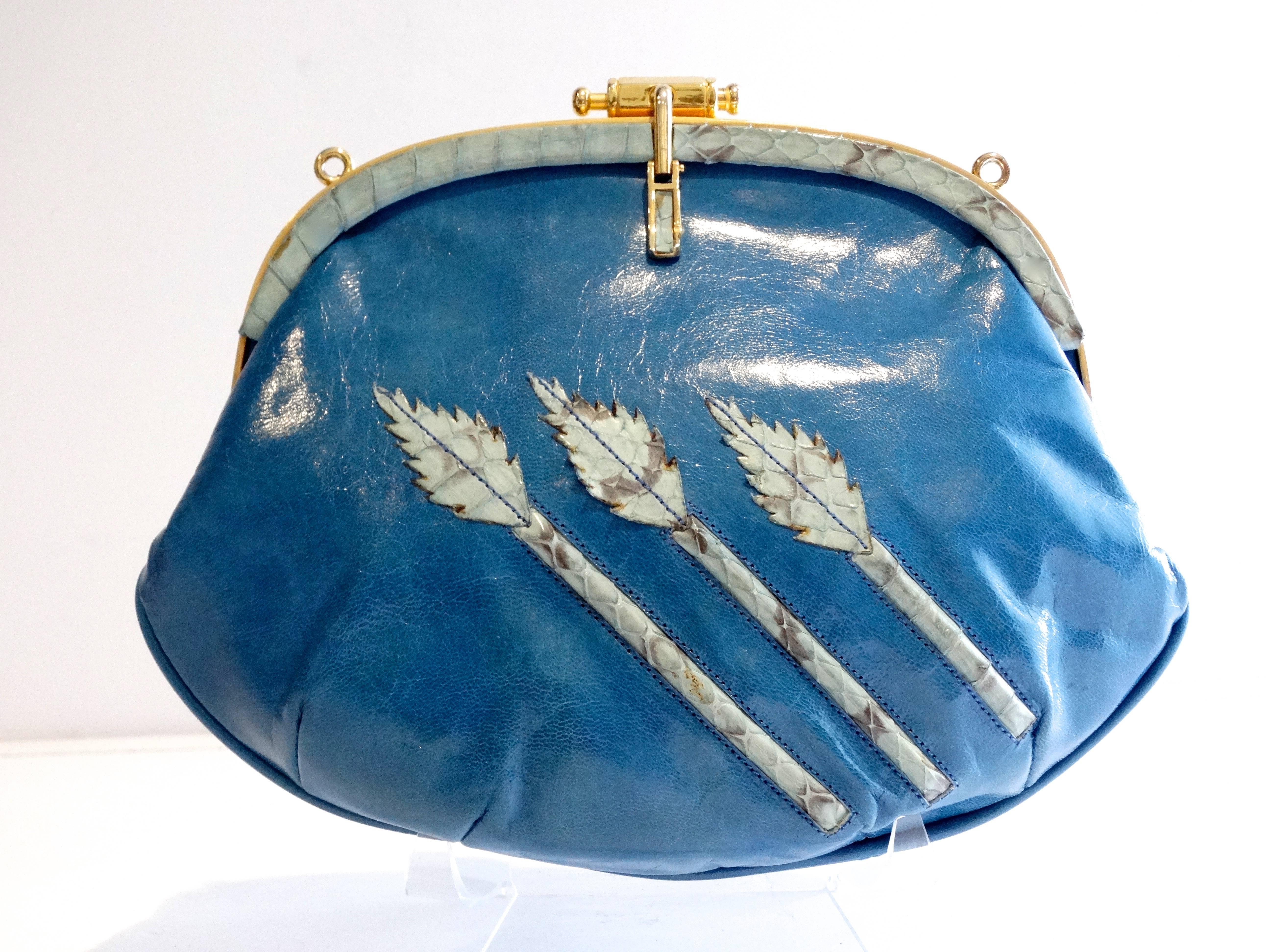 Beautiful 1970's  Nurhan shoulder bag crafted of richly smooth calfskin leather in Blue.The bag features a 3 beautiful Leaf design in blue python. A reinforced leather strap with gold hardware, which is detachable. This bag has a gold top closure