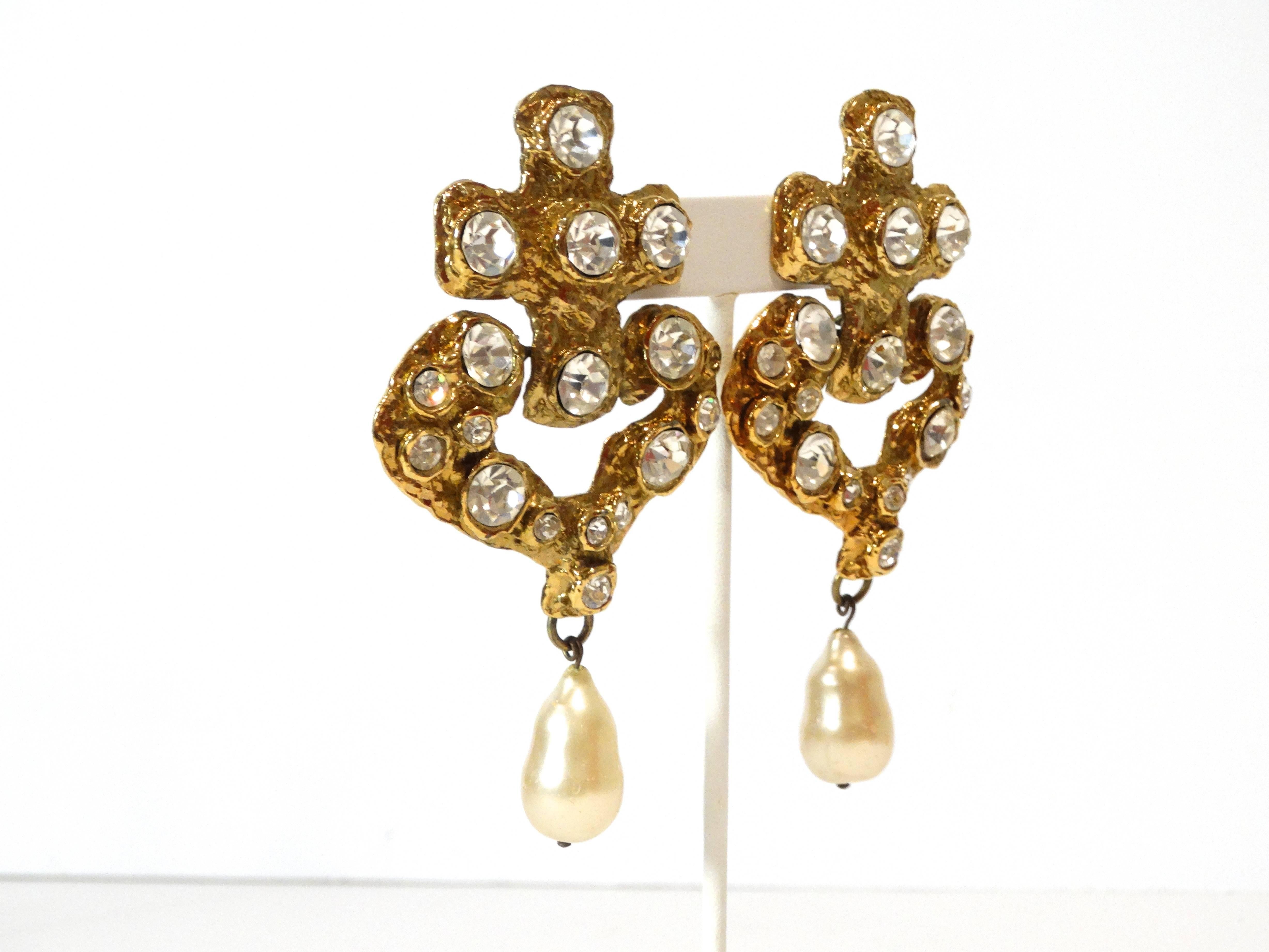 Massive Cross and Heart Shape Runway Earrings created by Christian Lacroix in the mid 1990's! Beautifully designed with one signal drop of pearl off of each earring. Large crystals cover the front of each earring. Clip-ons, Earrings are signed