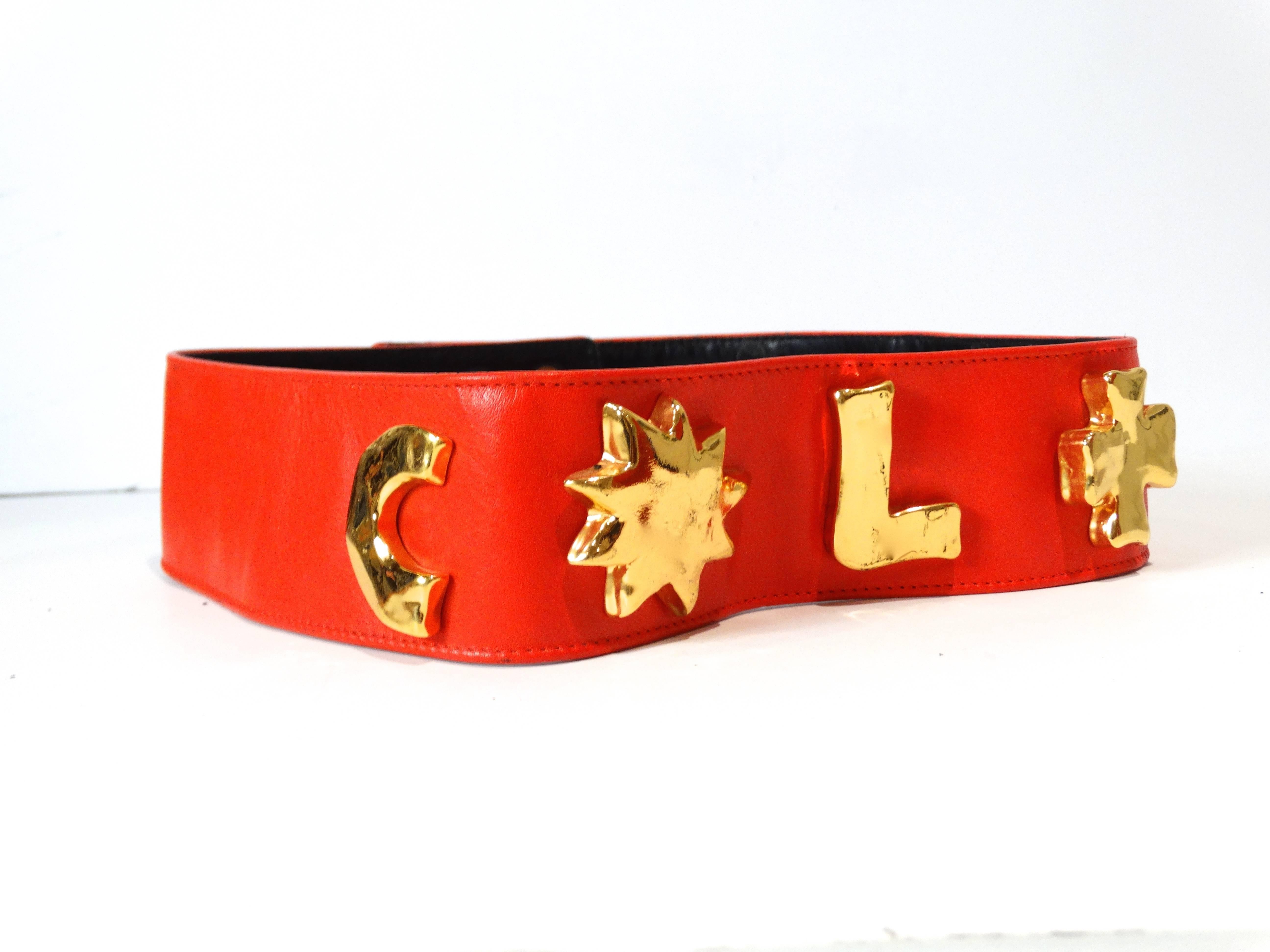 Make a statement with this iconic 1990's Christian Lacroix red leather belt with 5 gold raised iconic Lacroix emblems: C, Star, L, Cross and Heart. Adjustable double hook and holes closure.Stamped CHRISTIAN LACROIX PARIS 70/28 Made in France inside.