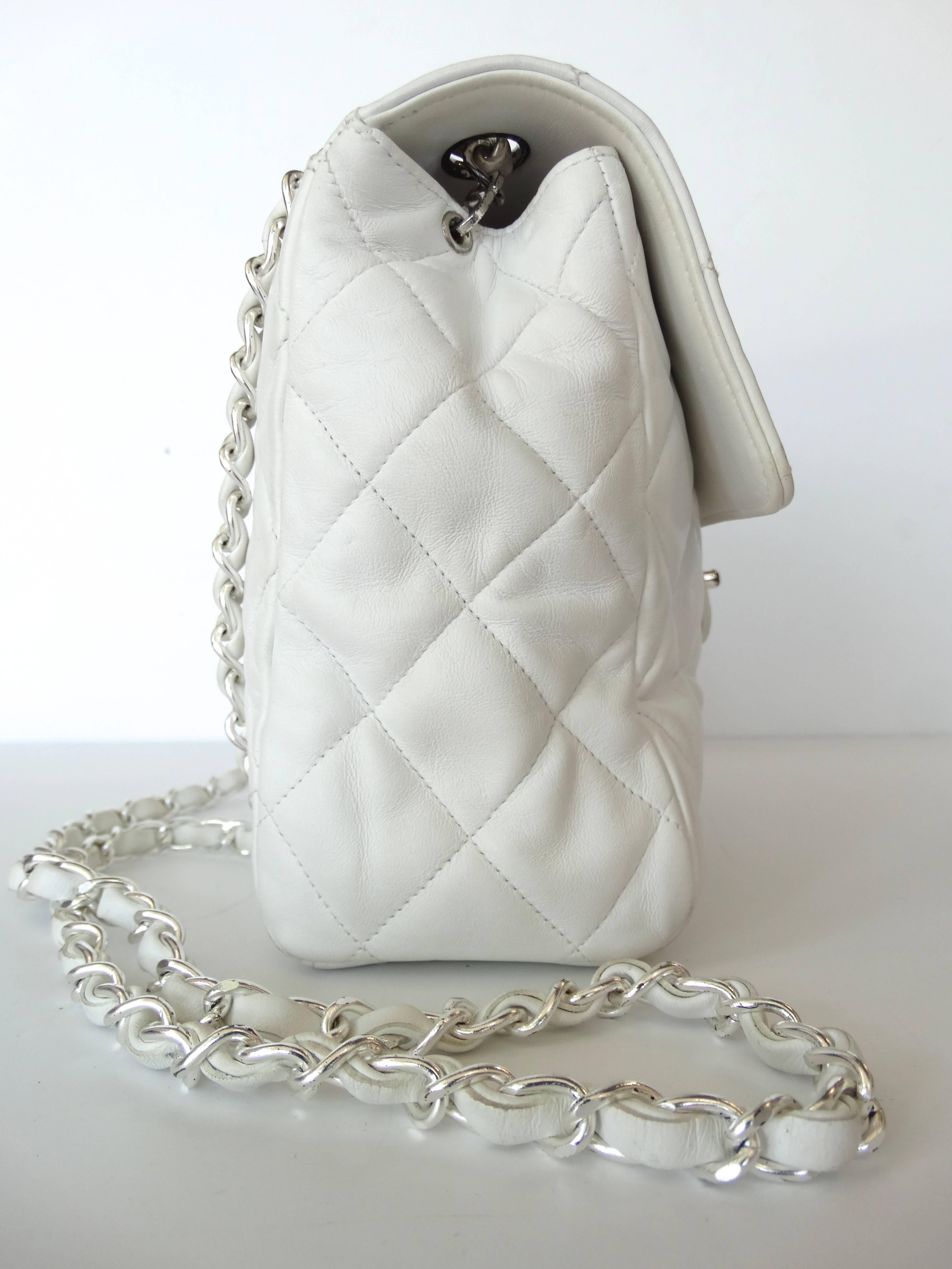 One of the most sought-after models within the house of Chanel, this timeless classic  1990's caviar flap is chic in a White, beautifully contrasted with Plated silver, single chain strap. This style is especially rare and hard to find in caviar 