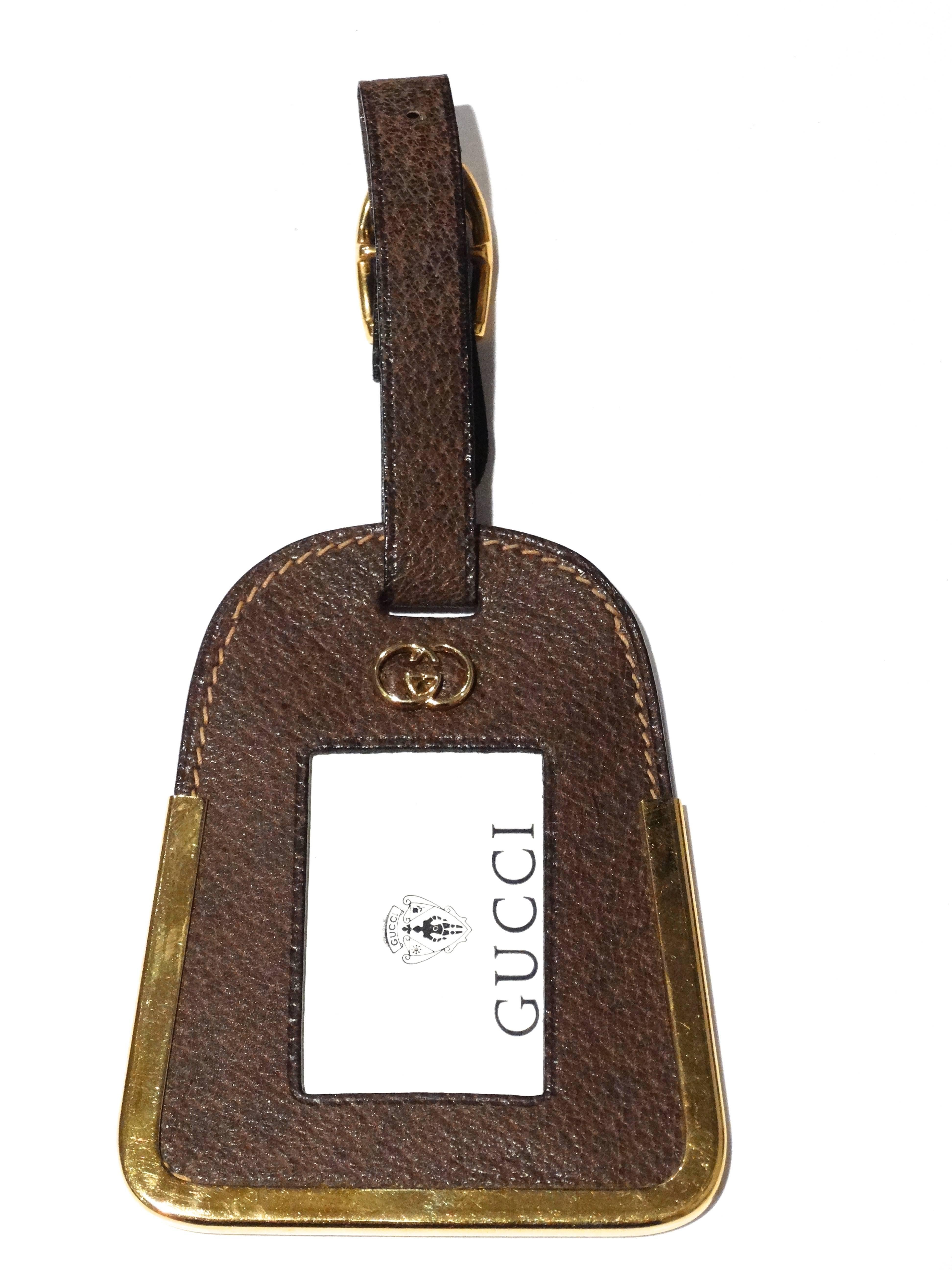 RARE and Often seen,  fine vintage GUCCI circa 1970's!  This luggage tag is in near new condition, AMAZING tag - a style that is no longer manufactured.  Great on a belt loop or wear as a pendent necklace. Crafted in supple tanned leather. Gold-tone