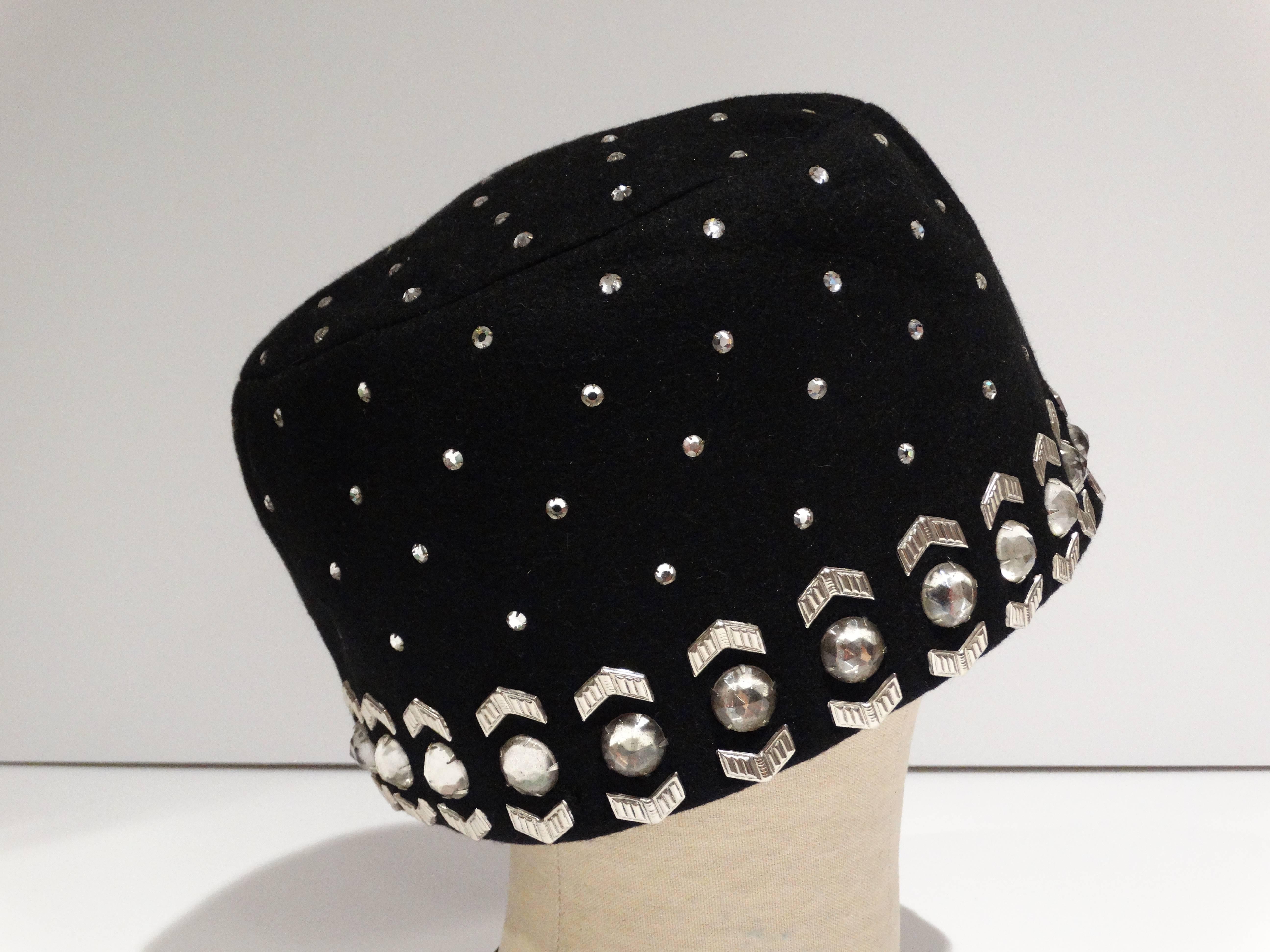 A wonderful Yves Saint Laurent black felt Fez style turban/ Pillbox Hat.., circa 1960's from the fabulous YSL! Rhinestones throughout- large and small, plus metal chevron decorative pieces. The large rhinestones measure 1/2